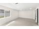 Spacious, bright room with light wood-look floors, neutral walls, and a glimpse of the outdoors at 4604 S Shore Rd, Orlando, FL 32839