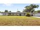 Charming home features a well-manicured lawn and inviting curb appeal at 4604 S Shore Rd, Orlando, FL 32839