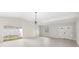 Bright open living room space, with a modern light fixture and sliding doors at 4604 S Shore Rd, Orlando, FL 32839