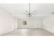Bright living area featuring vaulted ceilings, contemporary lighting, and large windows at 4604 S Shore Rd, Orlando, FL 32839