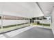 Enclosed patio overlooking the backyard, perfect for outdoor relaxation and entertaining at 4604 S Shore Rd, Orlando, FL 32839