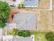 Overhead view of the home's roof, driveway, and landscaping showcasing the property's layout and surroundings at 5126 Rishley Run Way, Mount Dora, FL 32757
