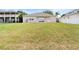 Large grassy backyard showcasing exterior of the home at 5126 Rishley Run Way, Mount Dora, FL 32757