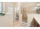 Bathroom showcasing tiled shower with glass door and neutral walls, open to the commode area at 5126 Rishley Run Way, Mount Dora, FL 32757