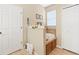 Bathroom featuring a soaking tub with a small shelf, tiled floors, and ample storage at 5126 Rishley Run Way, Mount Dora, FL 32757