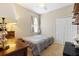 Cozy bedroom with neutral tones, a twin bed, closet, and ample natural light at 5126 Rishley Run Way, Mount Dora, FL 32757