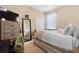 Cozy bedroom featuring carpet, a mirror with lights, closet, and neutral-toned walls at 5126 Rishley Run Way, Mount Dora, FL 32757