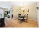 Bright dining room with hardwood floors and classic furnishings at 5126 Rishley Run Way, Mount Dora, FL 32757