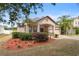 Single-story home with landscaped front yard and two-car garage in a suburban neighborhood at 5126 Rishley Run Way, Mount Dora, FL 32757