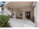 Covered front porch with seating area, perfect for relaxing and enjoying the neighborhood views at 5126 Rishley Run Way, Mount Dora, FL 32757