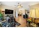 Living room with hardwood floors that flows into the dining room at 5126 Rishley Run Way, Mount Dora, FL 32757