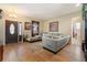 Comfortable living room with hardwood floors, natural light, and a cozy seating area at 5126 Rishley Run Way, Mount Dora, FL 32757