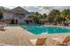 Resort-style pool with tanning deck and community building providing a relaxing oasis for residents at 5126 Rishley Run Way, Mount Dora, FL 32757