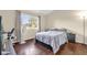 Cozy bedroom with ample natural light and hardwood floors, creating a warm and inviting space at 543 Azinger Cir, Orlando, FL 32824