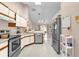 The kitchen is equipped with stainless steel appliances and plenty of counter space at 543 Azinger Cir, Orlando, FL 32824