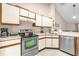 Clean kitchen featuring modern stainless-steel appliances, bright cabinets, and functional layout at 543 Azinger Cir, Orlando, FL 32824
