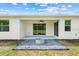 Relaxing backyard featuring an outdoor living area, fan, and a stylish fire pit at 5839 Tarleton Way, Mount Dora, FL 32757