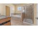 Bathroom featuring a granite counter top, tile shower, and a soaking tub at 5839 Tarleton Way, Mount Dora, FL 32757