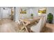 Elegant dining room with seating for six and stylish decor at 5839 Tarleton Way, Mount Dora, FL 32757