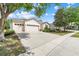 Charming single-story home with a well-manicured lawn, three-car garage, and paved driveway at 5839 Tarleton Way, Mount Dora, FL 32757