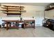 Spacious garage with workbench, shelving, tools, and ample storage for projects and equipment at 5839 Tarleton Way, Mount Dora, FL 32757
