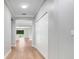 Hallway featuring new floors and neutral paint at 5839 Tarleton Way, Mount Dora, FL 32757