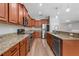Well-equipped kitchen with stainless steel appliances and ample granite countertop space at 5839 Tarleton Way, Mount Dora, FL 32757