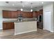 Well-lit kitchen featuring granite countertops, stainless steel appliances, and ample cabinet space at 5839 Tarleton Way, Mount Dora, FL 32757