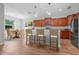 Bright kitchen with an island and adjacent dining area, perfect for entertaining at 5839 Tarleton Way, Mount Dora, FL 32757
