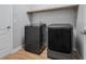 Laundry room with updated washer and dryer, built-in shelf, and tile flooring at 5839 Tarleton Way, Mount Dora, FL 32757