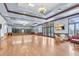 Expansive room with wood trim, natural light, and seating, perfect for gatherings or events at 5839 Tarleton Way, Mount Dora, FL 32757
