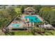 Relaxing community pool with a splash fountain and comfortable seating areas for residents to enjoy at 5839 Tarleton Way, Mount Dora, FL 32757