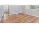 Bright room featuring light hardwood floors, neutral paint, and a large window at 5839 Tarleton Way, Mount Dora, FL 32757