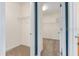 Spacious walk-in closet featuring carpet flooring and wire shelving for ample storage and organization at 5839 Tarleton Way, Mount Dora, FL 32757
