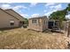 Large backyard features a shed and wooden play structure offering outdoor activities and storage at 6019 Long Peak Dr, Orlando, FL 32810