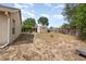 Expansive backyard featuring shed, privacy fence, and a mix of sun and shade perfect for outdoor activities at 6019 Long Peak Dr, Orlando, FL 32810