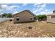 Large backyard with a storage shed and mature trees. Provides ample space for outdoor living and recreation at 6019 Long Peak Dr, Orlando, FL 32810