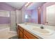 Bathroom showcasing double sinks, a vanity, a shower stall and a bathtub at 6019 Long Peak Dr, Orlando, FL 32810