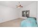 Bedroom featuring carpeted floors, ceiling fan, and natural light from the window at 6019 Long Peak Dr, Orlando, FL 32810