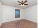 Empty bedroom with wood-look floors, white walls with border, and a ceiling fan with light at 6019 Long Peak Dr, Orlando, FL 32810
