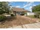 Charming single-story home with well-maintained landscaping, inviting front entrance, and a manicured front yard at 6019 Long Peak Dr, Orlando, FL 32810