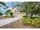 Charming single-Gathering home featuring a two-car garage and landscaped front yard at 6019 Long Peak Dr, Orlando, FL 32810
