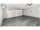 Spacious garage with concrete block walls, refinished floors, and an updated ceiling fan for optimal air circulation at 6019 Long Peak Dr, Orlando, FL 32810