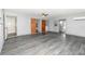 Expansive garage space with updated ceilings, refinished floors, and easy access to both interior and exterior entrances at 6019 Long Peak Dr, Orlando, FL 32810