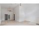 Open living room with high ceilings and access to back patio at 6019 Long Peak Dr, Orlando, FL 32810