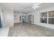 Sunroom with tile floors, bright lighting from windows and doors, and ceiling fans at 6019 Long Peak Dr, Orlando, FL 32810