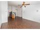 Living room with view to the kitchen and tile flooring at 6019 Long Peak Dr, Orlando, FL 32810