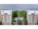 Aerial view of complex featuring beautiful pool, private pier, and parking at 6336 Buford St # 307, Orlando, FL 32835