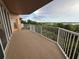 Spacious balcony with white railings, perfect for enjoying outdoor views at 6336 Buford St # 307, Orlando, FL 32835
