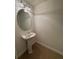 Powder room featuring pedestal sink, a mirror, neutral paint and tile floors at 6336 Buford St # 307, Orlando, FL 32835